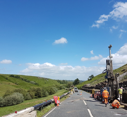 Rotary rig set up on the side of a country road drilling a borehole